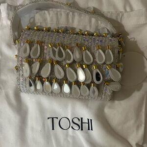Brand new Toshiba White and Gold Embellished Clutch with removable strap